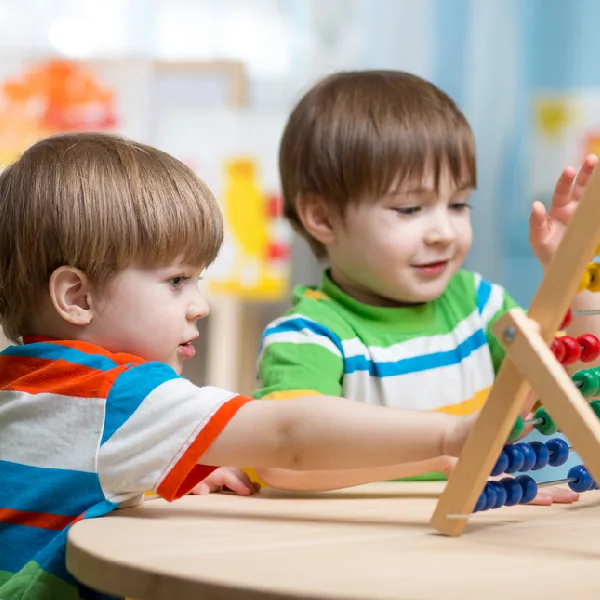 preschool students collaborating on an early math and logic game
