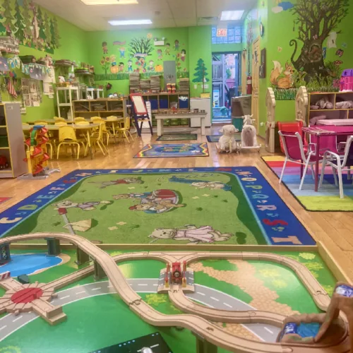 Daycare learning area with tables and educational materials