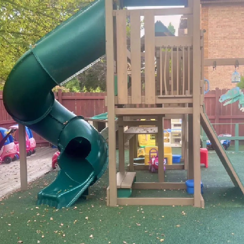 Outdoor play area with toys and turf at daycare facility Chicago