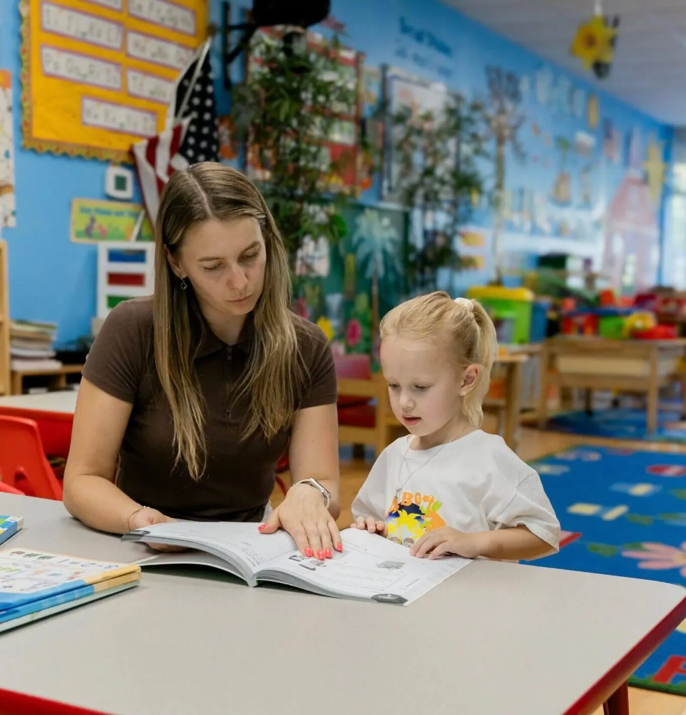 Teacher working with a toddler at Fantasy Island daycare near Norwood Park, Chicago